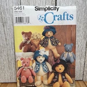 May include: Simplicity Crafts pattern 5461 featuring various teddy bear designs. The bears are shown wearing hats and vests. The pattern includes the text "ONE SIZE" and "UNA TALLA SOLA UNE SEULE TAILLE".