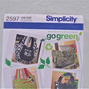 May include: A Simplicity sewing pattern package featuring images of tote bags. The package has the number 2597 and the words "ONE SIZE" in English, Spanish, and French. The phrase "go green" is also visible.