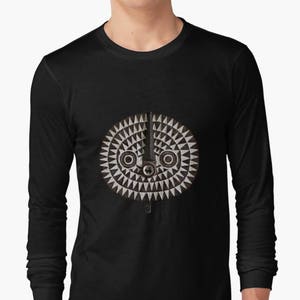 May include: A black long-sleeve shirt with a white and gray geometric design of a face with two eyes.