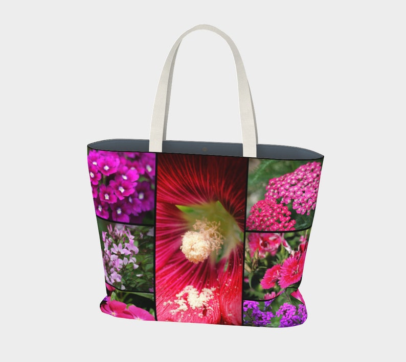 May include: A pink and purple floral tote bag with a white handle. The bag features a collage of different flowers, including pink, purple, and white blooms.