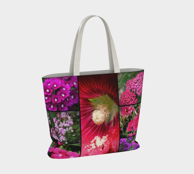 May include: A white tote bag with a collage of pink, purple, and red flowers. The flowers are arranged in a grid pattern on the bag.
