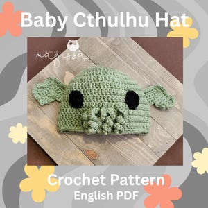 May include: Crochet pattern for a baby Cthulhu hat. The hat is green with black eyes and tentacles. The pattern is available as an English PDF download.