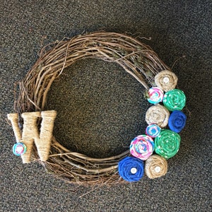 Grapevine wreath with personalized monogram and fabric/burlap flowers