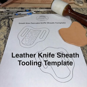 May include: A printed template for a small-size pancake knife sheath. The design includes a detailed floral pattern and the text "Leather Knife Sheath Tooling Template". A leather mallet and tools are visible.
