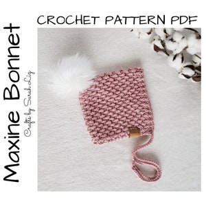 May include: A dusty rose crochet bonnet with a white faux fur pom-pom. The bonnet has a textured stitch pattern and a small leather tag. The text "Maxine Bonnet" and "CROCHET PATTERN PDF" are visible.