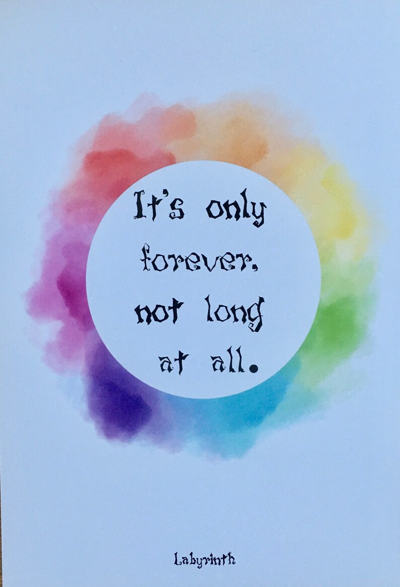 May include: A watercolor painting of a rainbow circle with the text "It's only forever, not long at all." in black lettering. The text is inside a white circle. The text is in a handwritten font. The background is light blue.
