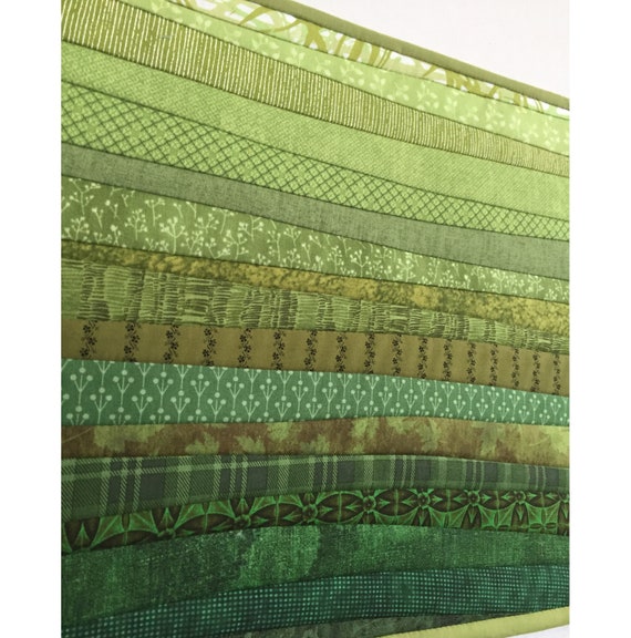 Two quilted green placemats. 13 by 19 inches. Washable mats as Etsy