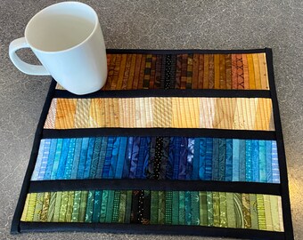 This small quilted mug rug or wall art will add a splash of color to your home office or kitchen. A special gift for that special person.