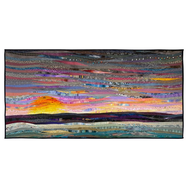 The dawning is an original abstract art quilt capturing sunrise through the mist. At 30 by 60 in. it is a pieced landscape in modern decor.