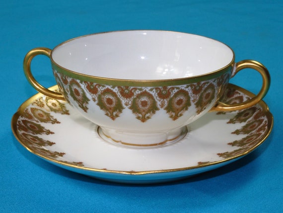 W Guerin & Co White Two Handles Porcelain Teacup and Saucer With Gold Trim  