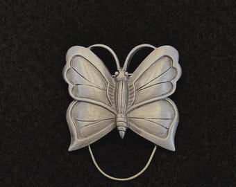 Broche vintage "Torino" con colgante de mariposa en tono plateado - Años 70-80