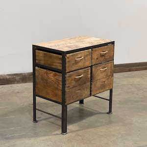 May include: A six-drawer wooden cabinet with a black metal frame and legs. The drawers are made of reclaimed wood and have rope handles.