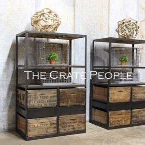 May include: Two black metal industrial shelving units with wooden crates and wire baskets. The shelves are stacked with crates and baskets, and there are decorative items on the top shelves. The text "THE CRATE PEOPLE" is visible in the center of the image.