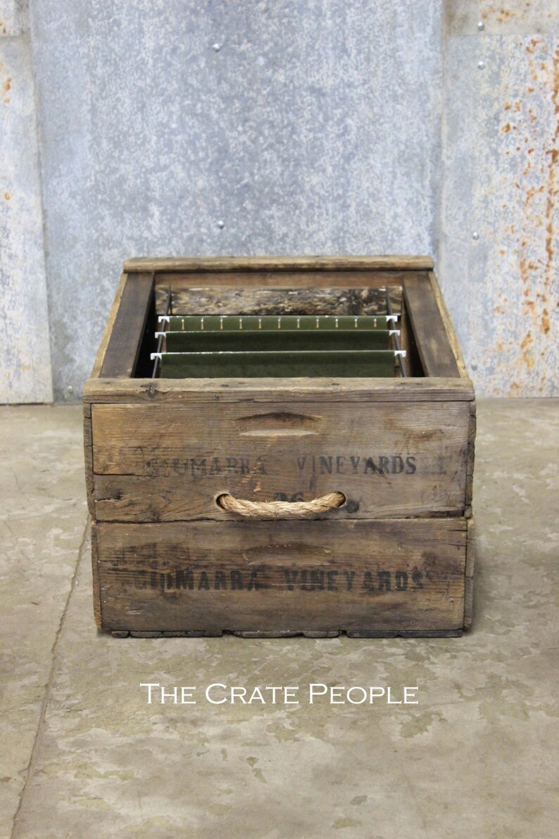 May include: A wooden crate with rope handles, repurposed as a file organizer. The crate is labeled "Sommarra Vineyards".