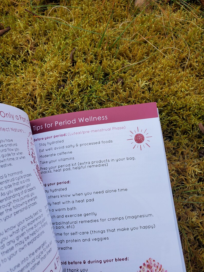 May include: A pink and white booklet with the title "Tips for Period Wellness" and a list of tips for managing your period. The booklet is open to a page with the heading "Before your period: (Luteal/pre-menstrual Phase)" and a list of tips for staying hydrated, eating well, and preparing for your period.