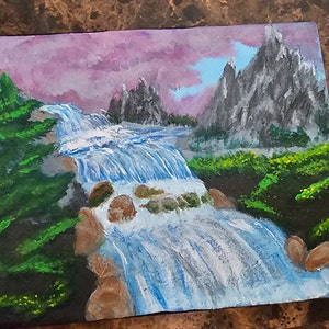 Acrylic landscape of a river running through mountains and trees with a pinkish sky. Painted with acrylic paint on 8x10 canvas.