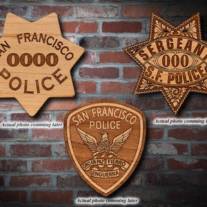 May include: Three wooden plaques with a star-shaped design, featuring the text "SAN FRANCISCO POLICE" and "SERGEANT S.F. POLICE" with a badge number. The third plaque is a shield shape with the text "SAN FRANCISCO POLICE" and "ORO EN PAZ FIERRO ENGUERRA".