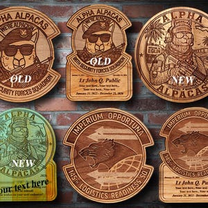 May include: A selection of wooden plaques with laser-engraved designs. The plaques feature alpaca characters in military attire, with text including "Alpha Alpacas" and unit designations. Some plaques have personalized text and dates.