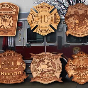 May include: A collection of six wooden ornaments featuring the Inwood Fire Department logo. The ornaments are decorated with various fire department symbols, including an eagle, a ladder, and a fire hydrant. The text on the ornaments includes "Inwood Fire Department", "Engine Company 311", "Tower Ladder", "Squad 318", and "Excuse Me Brothers".