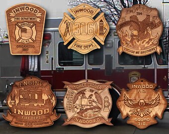 May include: A collection of six wooden ornaments featuring the Inwood Fire Department logo. The ornaments are decorated with various fire department symbols, including an eagle, a ladder, and a fire hydrant. The text on the ornaments includes "Inwood Fire Department", "Engine Company 311", "Tower Ladder", "Squad 318", and "Excuse Me Brothers".