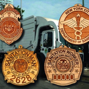 May include: Four wooden ornaments featuring the New York City Department of Sanitation logo. The ornaments are in the shape of badges and feature the city seal, the words "Sanitation Man", "Sanitation Worker", "Supervisor", and "New York City Department of Sanitation".