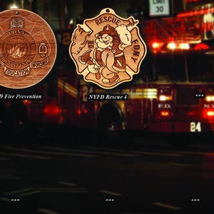 May include: Two wooden ornaments with a firefighter theme. One is round with the text "NYFD Fire Prevention" and the other is a shield shape with a cartoon firefighter and the text "NYFD Rescue 4".