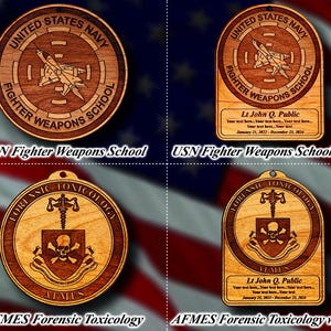 May include: Two wooden ornaments, one with the text "USN Fighter Weapons School" and the other with the text "AFMES Forensic Toxicology". Both ornaments feature a circular design with a skull and crossbones.