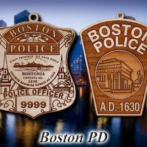 May include: Two wooden Boston Police badges. One is shield-shaped with the words "Boston Police Officer" and "9999" engraved. The other is a crest shape with "Boston Police" and "A.D. 1630" engraved. The text "Boston PD" is at the bottom.