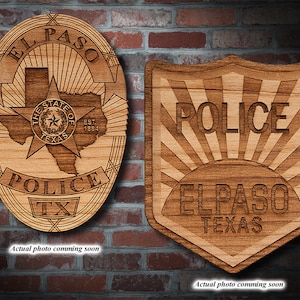 May include: Two wooden plaques with laser-engraved El Paso Police Department badges. The first badge features a star and the state of Texas with the text "EL PASO" and "POLICE TX". The second badge features a sunburst design with the text "POLICE" and "ELPASO TEXAS".