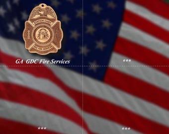 May include: A wooden Station Chief badge with the text "GA GDC Fire Services" against a blurred American flag background. The badge features an eagle, the words "Station Chief", and a central emblem.