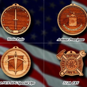 May include: Four wooden ornaments with different designs. The top left ornament features a dagger with the text "TERTIA OPTIO" and "Tertia Potio". The top right ornament features a shield with the text "ACTIONES PRAECIPE AF" and "UNITED STATES OF AMERICA" and "Actiones Praecipuae". The bottom left ornament features a bow and arrow with the text "CIANCS SOG Special Ops". The bottom right ornament features a wrench and an axe with the text "312TH TRS" and "RAIN DEVELOP INSPIRE" and "GAFB, TX" and "312th TRS".