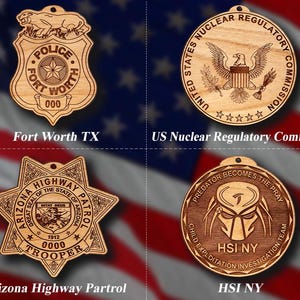 May include: Four circular and shield-shaped wooden ornaments featuring laser-engraved designs: the Fort Worth Police badge, the United States Nuclear Regulatory Commission seal, the Arizona Highway Patrol star badge, and the HSI NY Predator emblem.