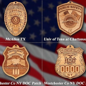 May include: Four wooden laser-engraved badges with different designs. The top left badge is a police badge with the text "Sergeant McAllen Police 0000". The top right badge is a public safety badge with the text "Public Safety University of Tennessee Justice at Chattanooga C". The bottom left badge is a corrections badge with the text "Department of Corrections Westchester County". The bottom right badge is a corrections badge with the text "Westchester County Corrections 0000 NY".