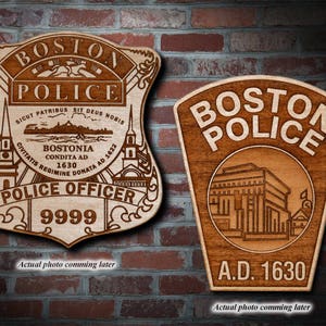 May include: Two wooden plaques with the words "Boston Police" and a design of a building. The top plaque has the words "Sicut Patribus Sit Deus Nobis" and "Civitatis Regimine Donata AD 1622" and "Bostonia Condita AD 1630". The bottom plaque has the words "A.D. 1630".