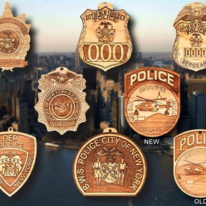 May include: Ten wooden ornaments featuring the New York City Police Department logo. The ornaments are in various shapes and sizes, including shields, stars, and badges. The ornaments are all made of wood and have a natural finish. The ornaments are all decorated with the New York City Police Department logo, which features a shield with the city's coat of arms and the words "City of New York Dep. Police".