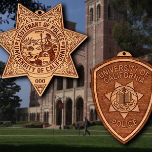 May include: Two wooden ornaments shaped like a star and a shield. The star ornament has the text "Lieutenant of Police University of California" and "Eureka" with a depiction of a woman standing on a rock. The shield ornament has the text "University of California" and "Police" with a depiction of a book and a star.