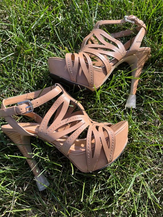 High heels sinking shop in grass