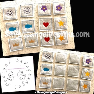 Könnte beinhalten: Eine Sammlung quadratischer, grauer Stoffflicken mit gestickten Designs. Die Flicken zeigen ein Smiley, Blumen, einen Fisch, ein Herz, einen Stern und eine Krone. Die Flicken sind mit blauen Nähten umrandet.