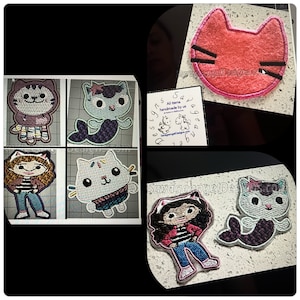 Puede incluir: Un conjunto de seis parches bordados para planchar con diseños de personajes de dibujos animados. Los parches incluyen un gato rosa con un lazo, un gato sirena morado, una niña con cabello castaño que lleva una chaqueta roja y jeans azules, un gato blanco con una bufanda azul, un gato sirena azul y un gato rojo con bigotes negros. Los parches están hechos a mano y están disponibles para su compra en el sitio web de Savageangel Designs.
