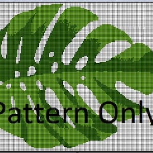 Puede incluir: Un patrón de punto de cruz de una hoja de monstera verde y blanca. El patrón es para una sola hoja con fondo blanco. El texto "Pattern Only" está en la parte inferior de la imagen.