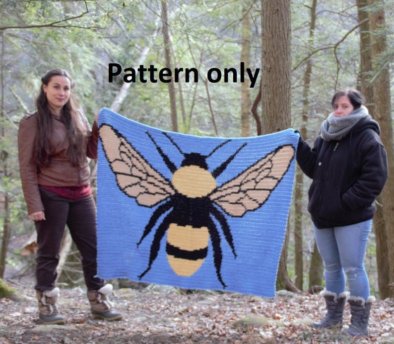 May include: A crochet pattern for a blue blanket with a large yellow and black bumblebee design. The pattern is called "Pattern only".
