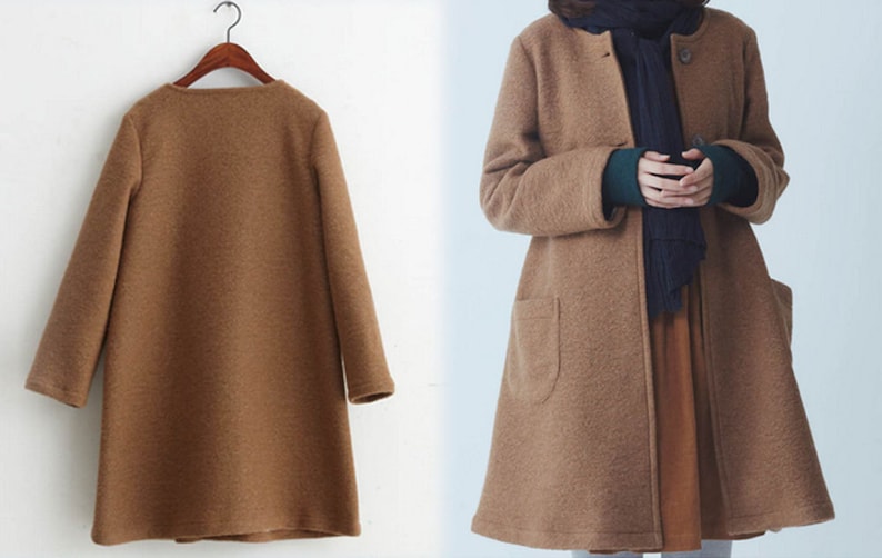 May include: A brown long-sleeved coat with a simple design and a slightly flared hem. The coat has a button closure and two pockets.