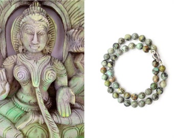 Handgeknoopte armband Afrikaanse Turkoois  (8mm) met sterling zilveren haakslot, Bali, Indonesië
