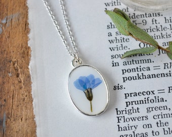 Delicate Forget Me Not Pressed Flower Necklace on White Background | One of a Kind Resin Pressed Flower Necklace