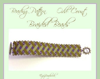 May include: A beaded bracelet with a green, purple, and white pattern. The bracelet is made with braided beads and has a clasp on one end. The text "Beading Pattern Odd-Count Braided Beads" is at the top of the image. The text "Easy Beadwork by Nicole © 2017" is at the bottom of the image.