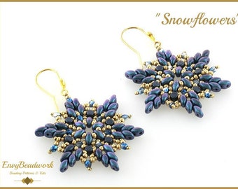 May include: A pair of gold snowflake earrings with blue and gold beads. The earrings are called "Snowflowers".