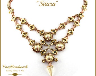 May include: A gold and brown beaded necklace with a geometric design and a large crystal pendant. The necklace is called "Sitara" and is from Envy Beadwork.