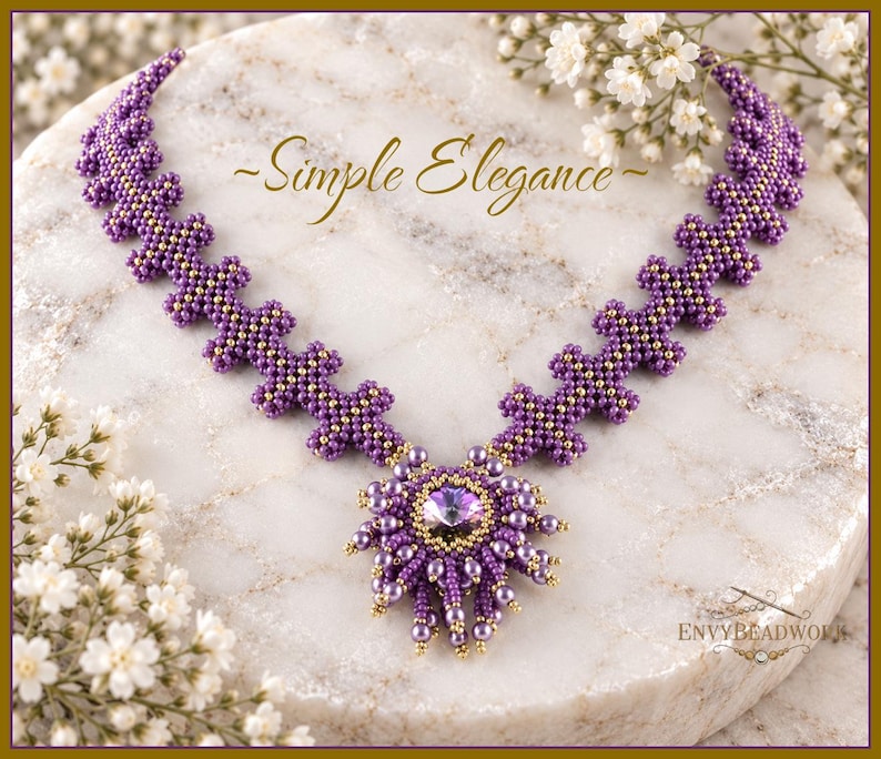May include: A beaded necklace featuring a central purple crystal pendant surrounded by small purple pearls and gold beads. The chain consists of repeating purple and gold bead clusters. The text "~Simple Elegance~" and "ENVYBEADWORK" appear.