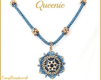 May include: A blue and gold beaded necklace with a large, intricate pendant. The pendant is a starburst design with a central bead and smaller beads surrounding it. The necklace is called "Queenies".