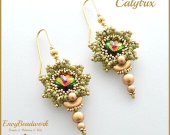 May include: A pair of gold earrings with green and gold beadwork. The earrings feature a star-shaped design with a clear iridescent crystal in the center. The earrings are accented with gold beads and a gold crescent moon.